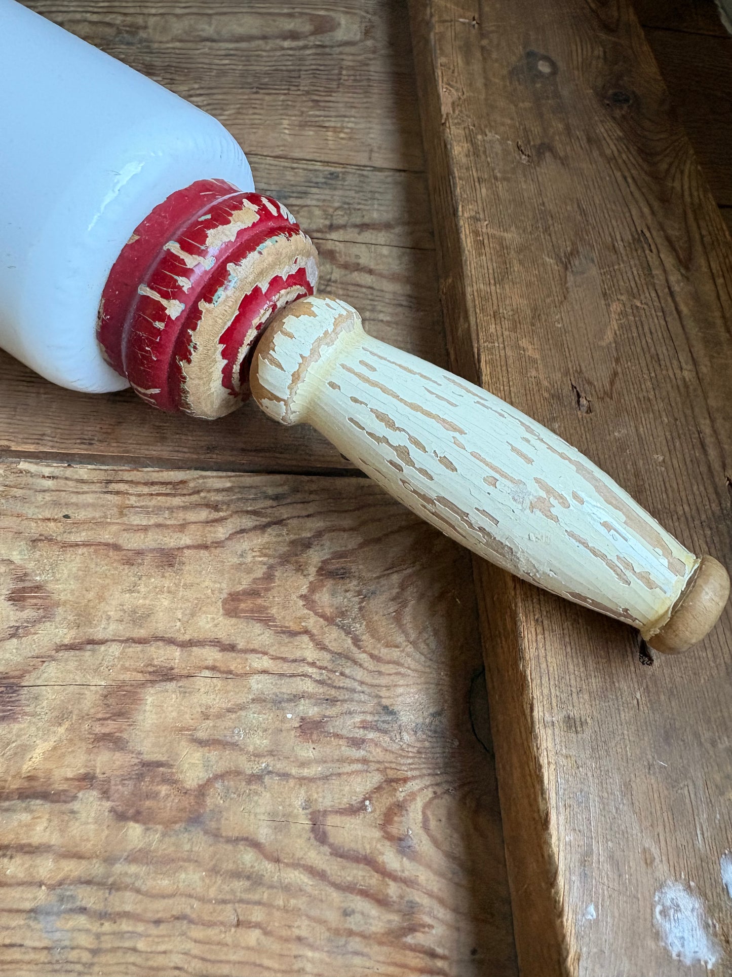 Close up view of antique wooden handle of rolling pin with vintage wear