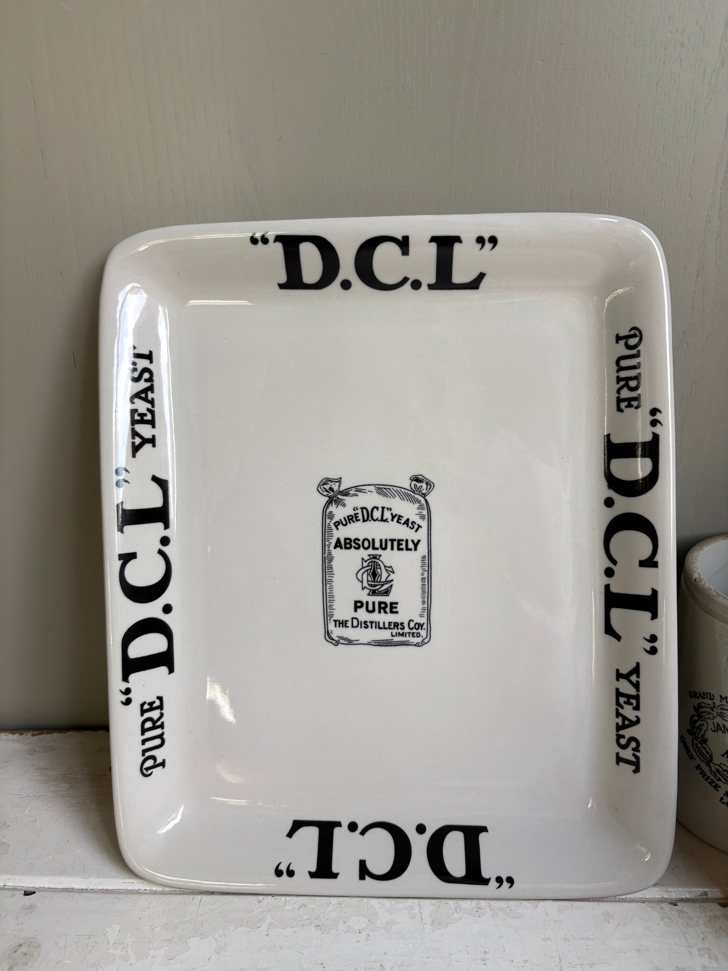 Antique Early 20th century English ironstone DCL Yeast advertising shop counter display plate.