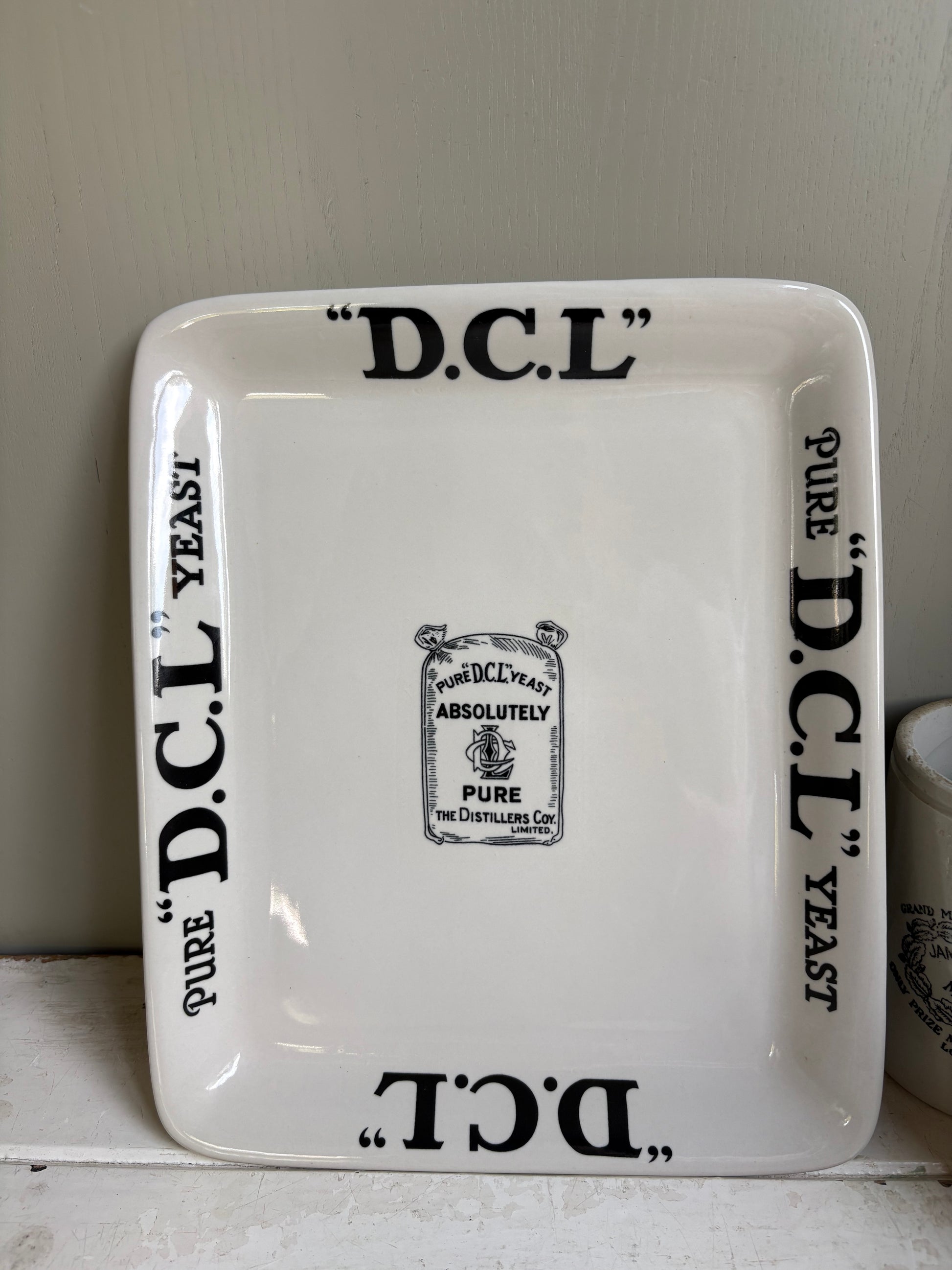 Antique Early 20th century English ironstone DCL Yeast advertising shop counter display plate.
