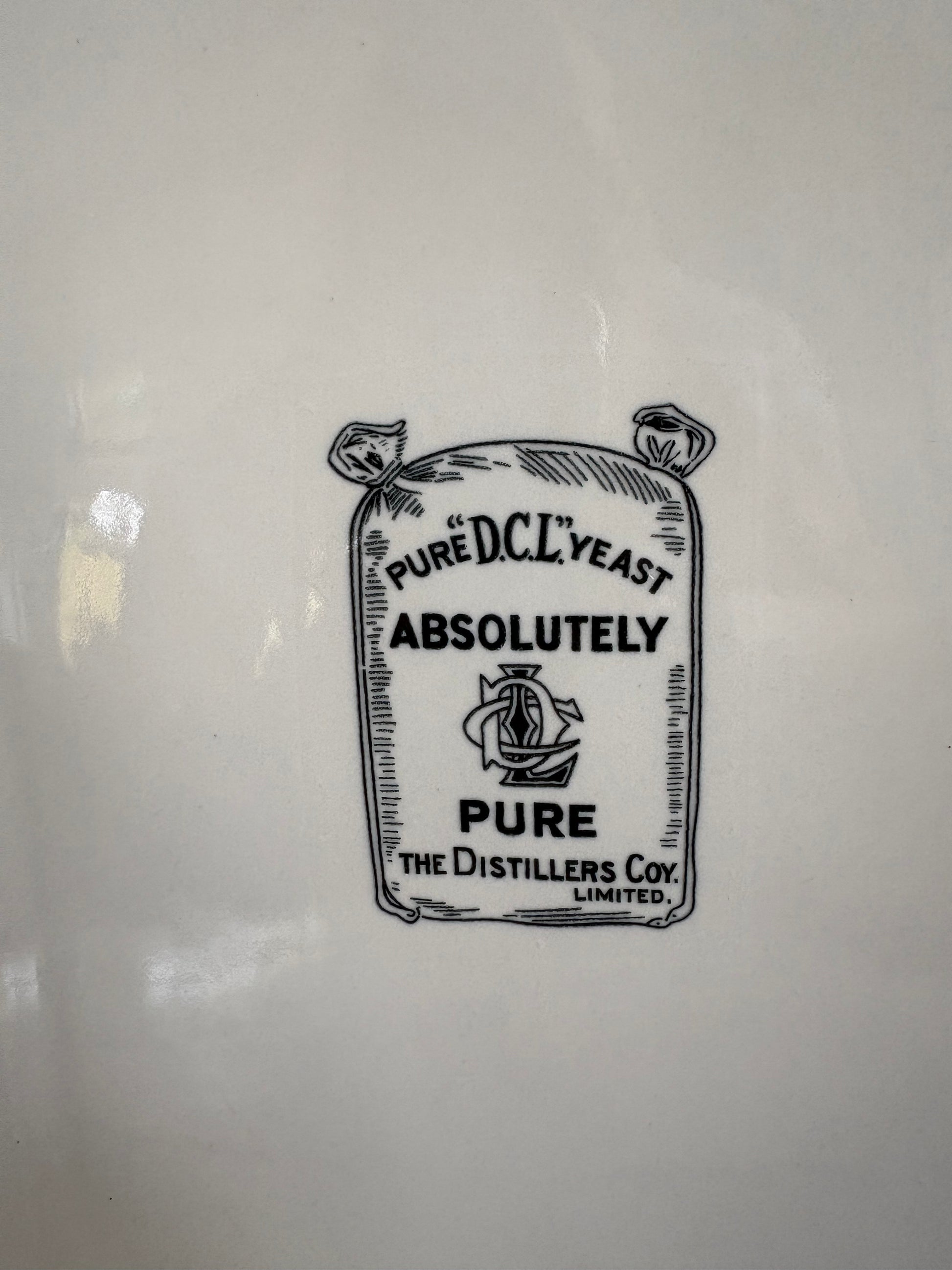 A close up image of decal, 'Pure DCL Yeast, Absolutely Pure, The Distillers Coy