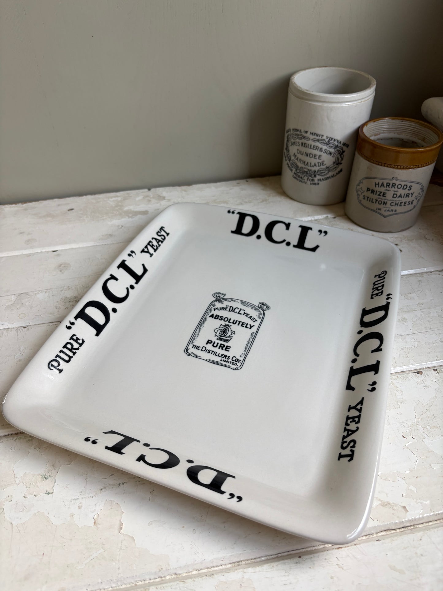 Clera image of antique English ironstone DCL Yeast advertising shop counter display plate