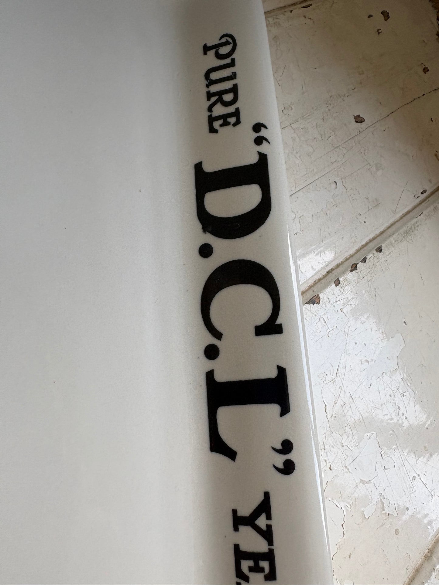 Close up shot of 20th century English ironstone DCL Yeast advertising shop counter display plate