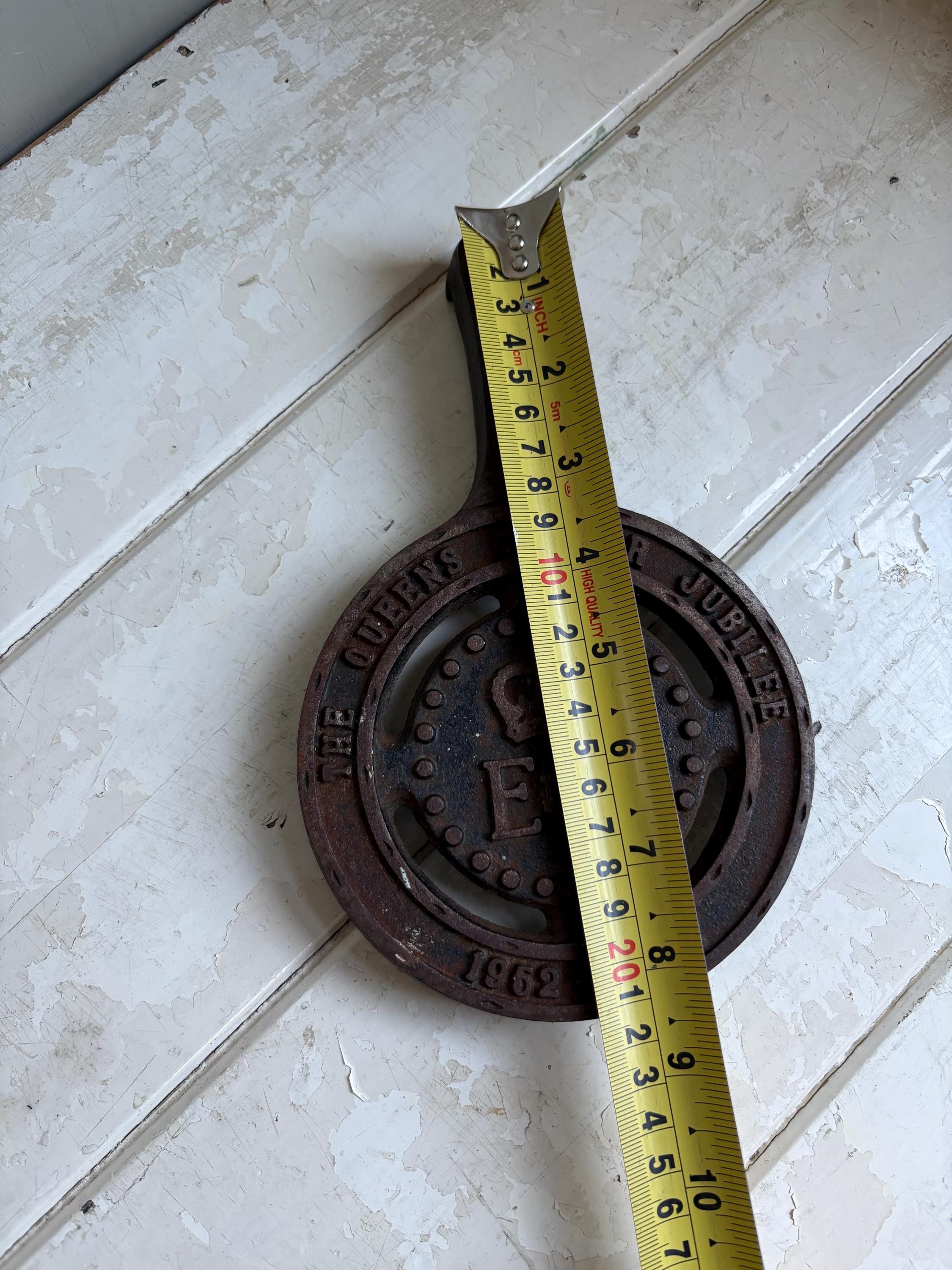 Silver Jubilee Cast Iron Trivet.