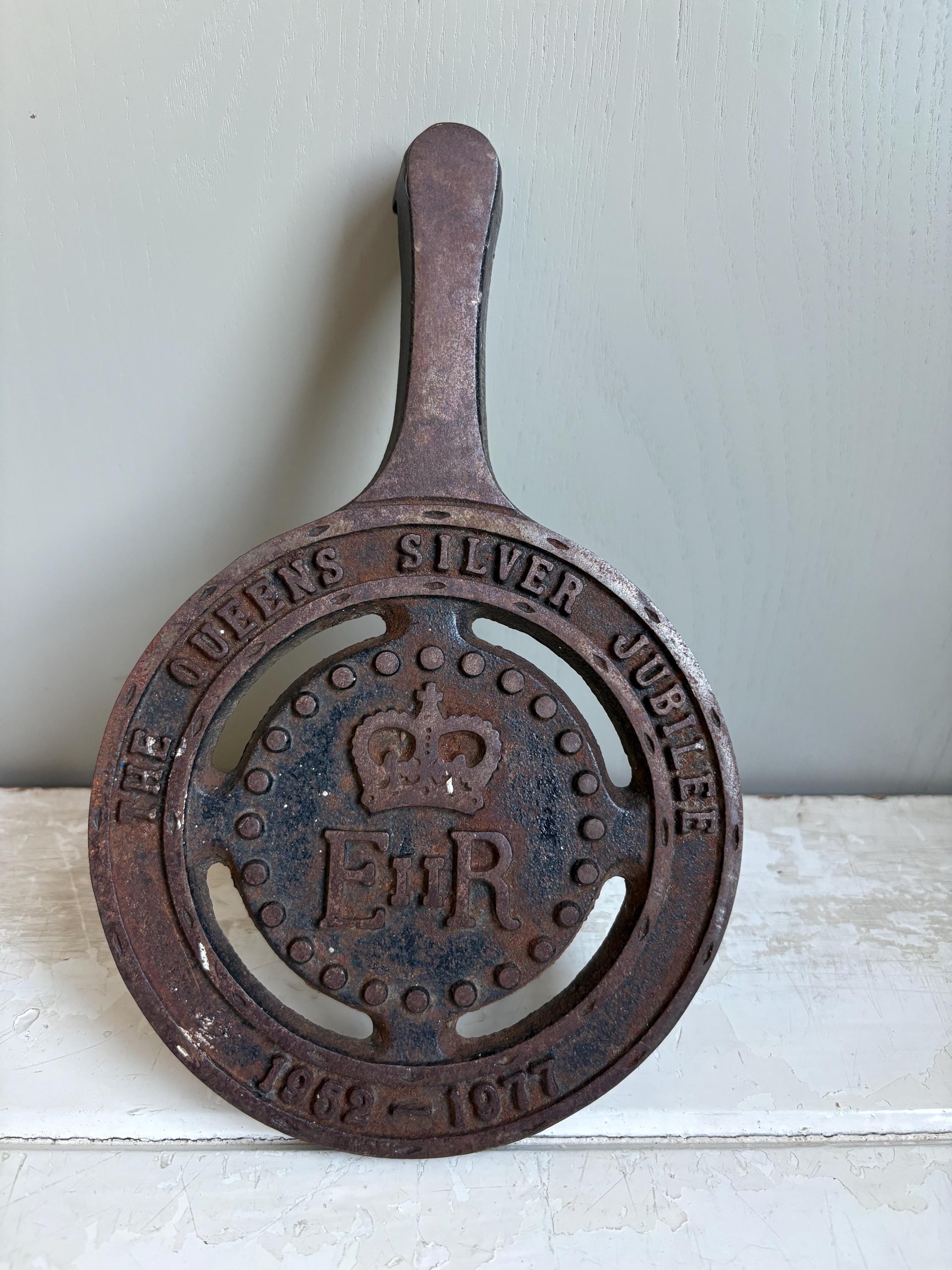 Silver Jubilee Cast Iron Trivet.