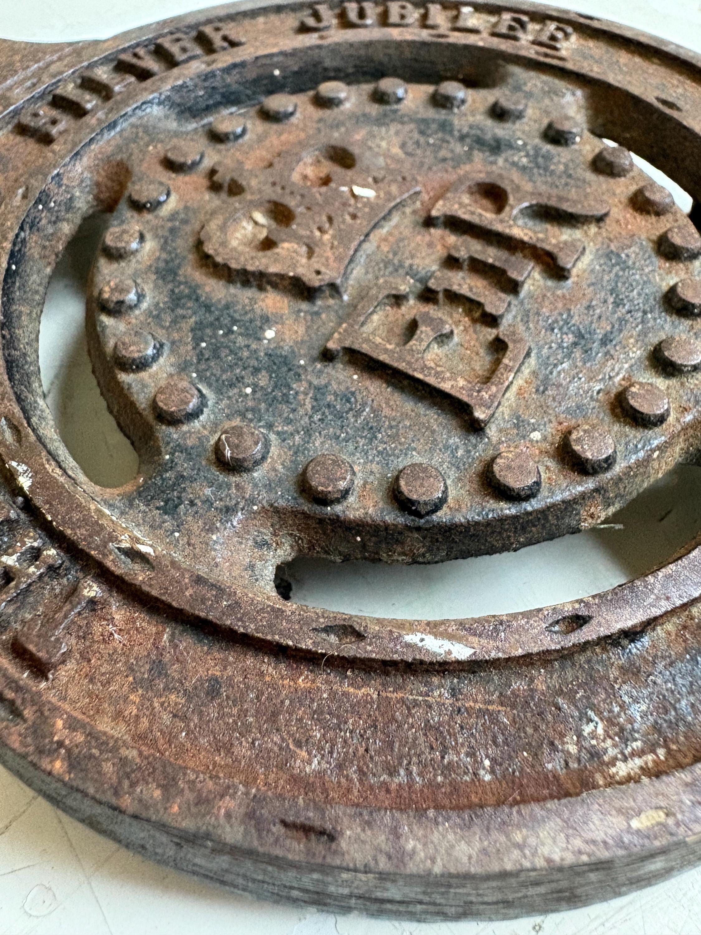 Silver Jubilee Cast Iron Trivet.