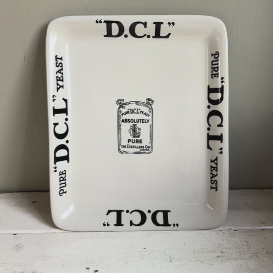 Early 20th century English ironstone DCL Yeast advertising shop counter display plate with black typography graphics.