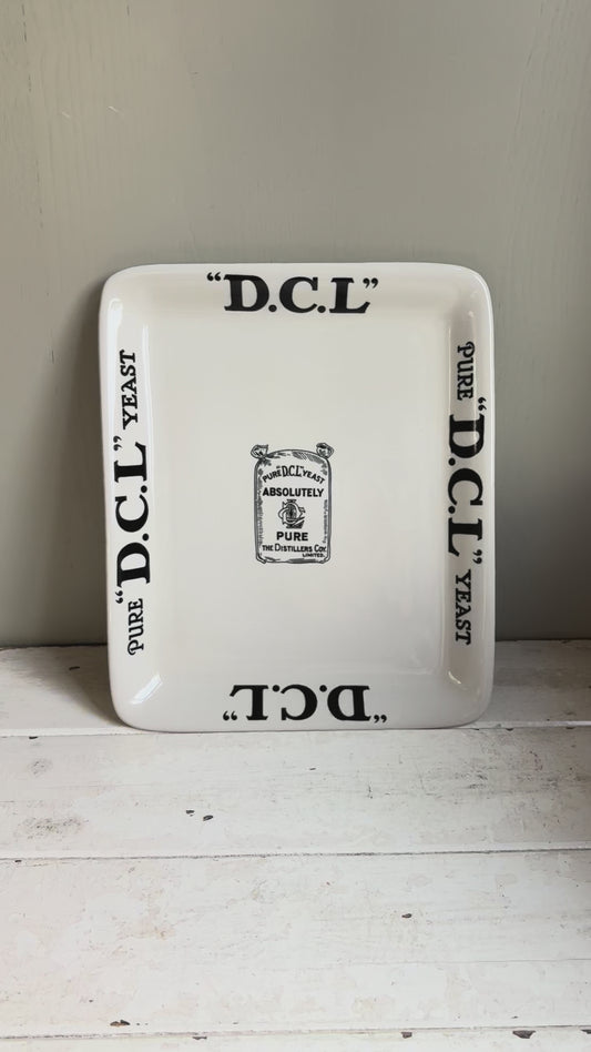 Early 20th century English ironstone DCL Yeast advertising shop counter display plate with black typography graphics.